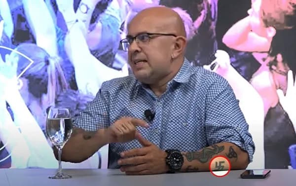 Profesional de la justicia y su polémico tatuaje: Esvástica en el antebrazo genera revuelo